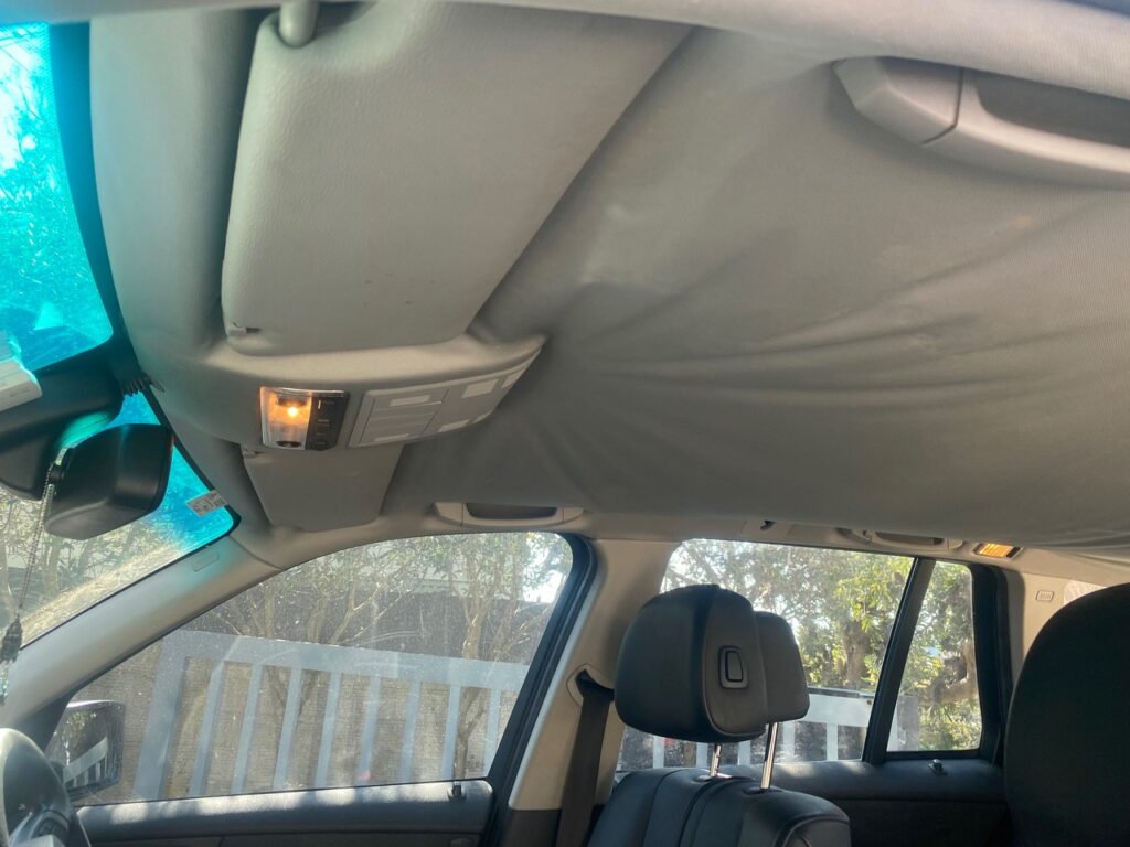 BMW X3 drooping roof lining repair before