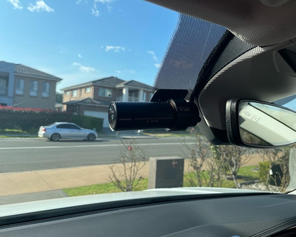 BlackVue Car Dash Cam Installation in Epping Professional mobile car dash cam installation service at home in Epping – technician hardwiring a dash cam neatly inside a car.